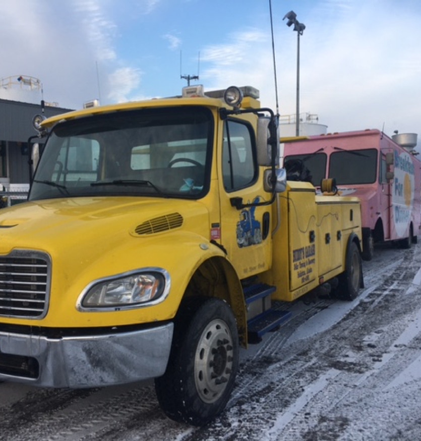 A large group of uniformed individuals standing in formation outdoors, illustrating discipline and unity.
